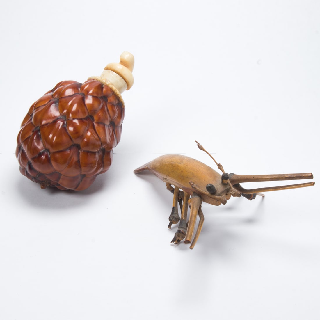 A pinecone snuff bottle and a carved bamboo crustacean (1 of 2)