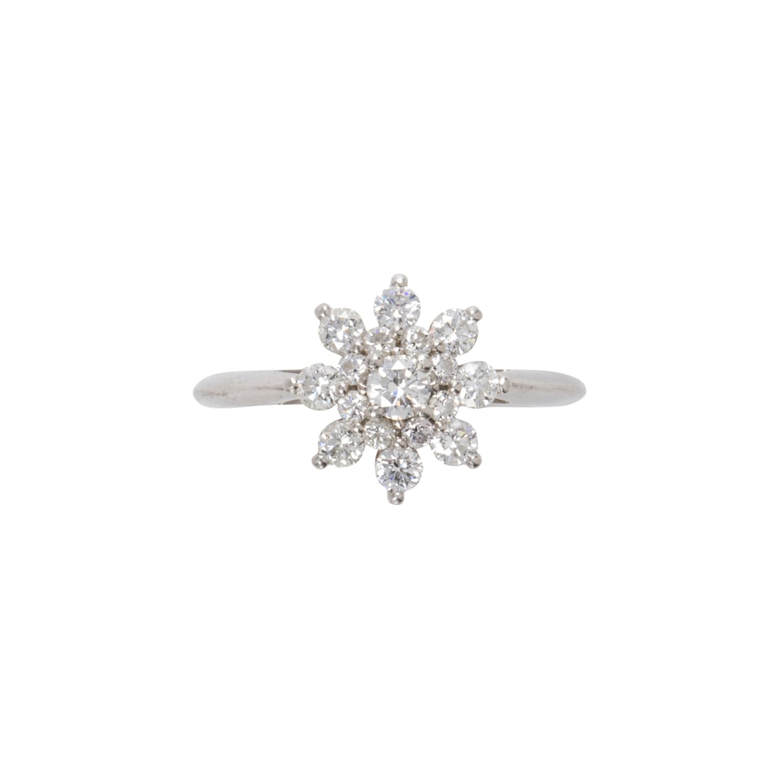 A Tiffany & Co. diamond and platinum ring: A Tiffany & Co. diamond and platinum ring of floriform design, featuring 17 round brilliant-cut diamonds; estimated total diamond weight 0.50 carat, signed Tiffany & Co. PT950; 4.5 grams; size: 5