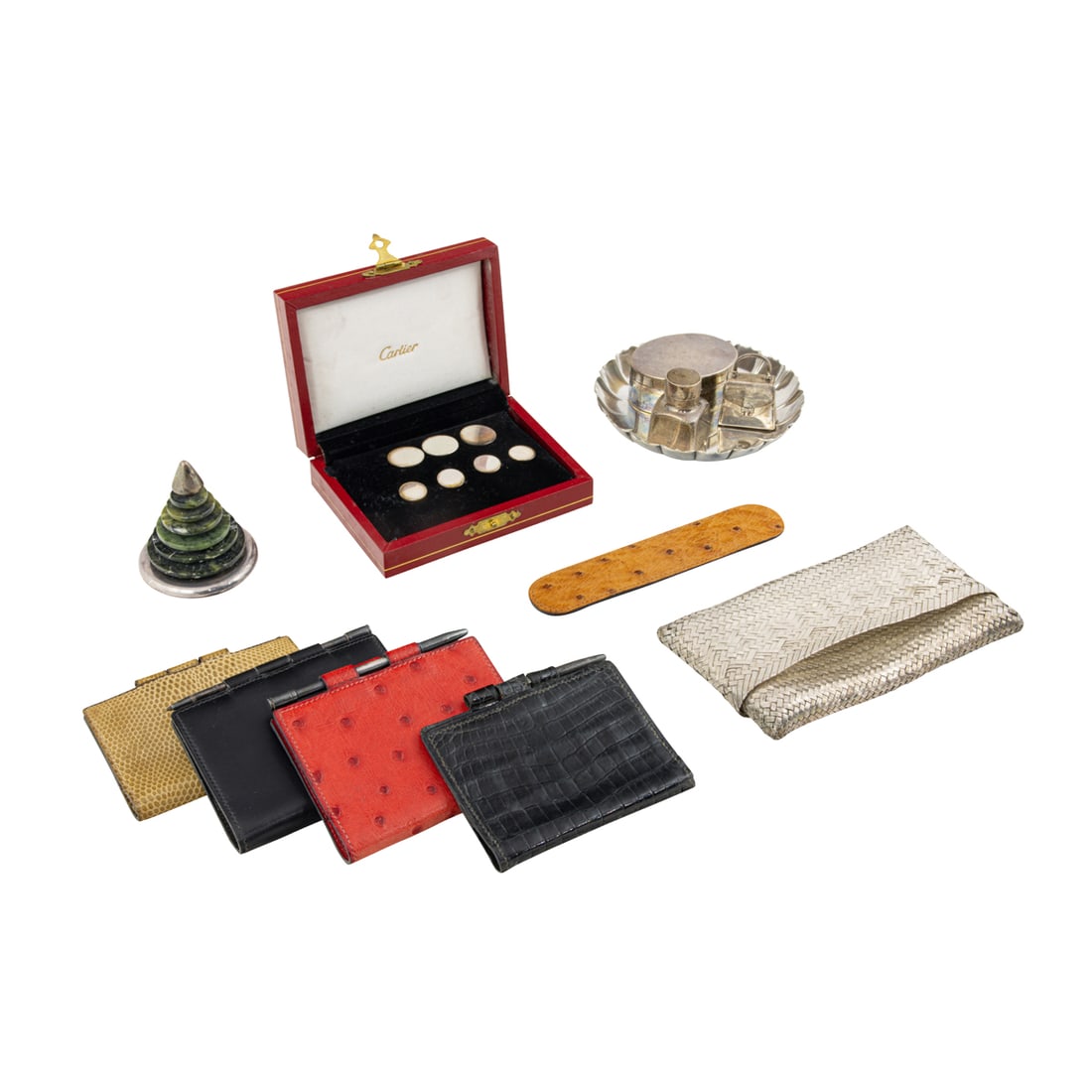 A lot of sterling and accessories by Hermes, Cartier, Tiffany and Bulgari: An assembled group of designer sterling and other personal accessories, comprising (4) vintage Hermes leather agenda notebooks including ostrich, snake and crocodile leather, 4" x 3"; a cased set Cart