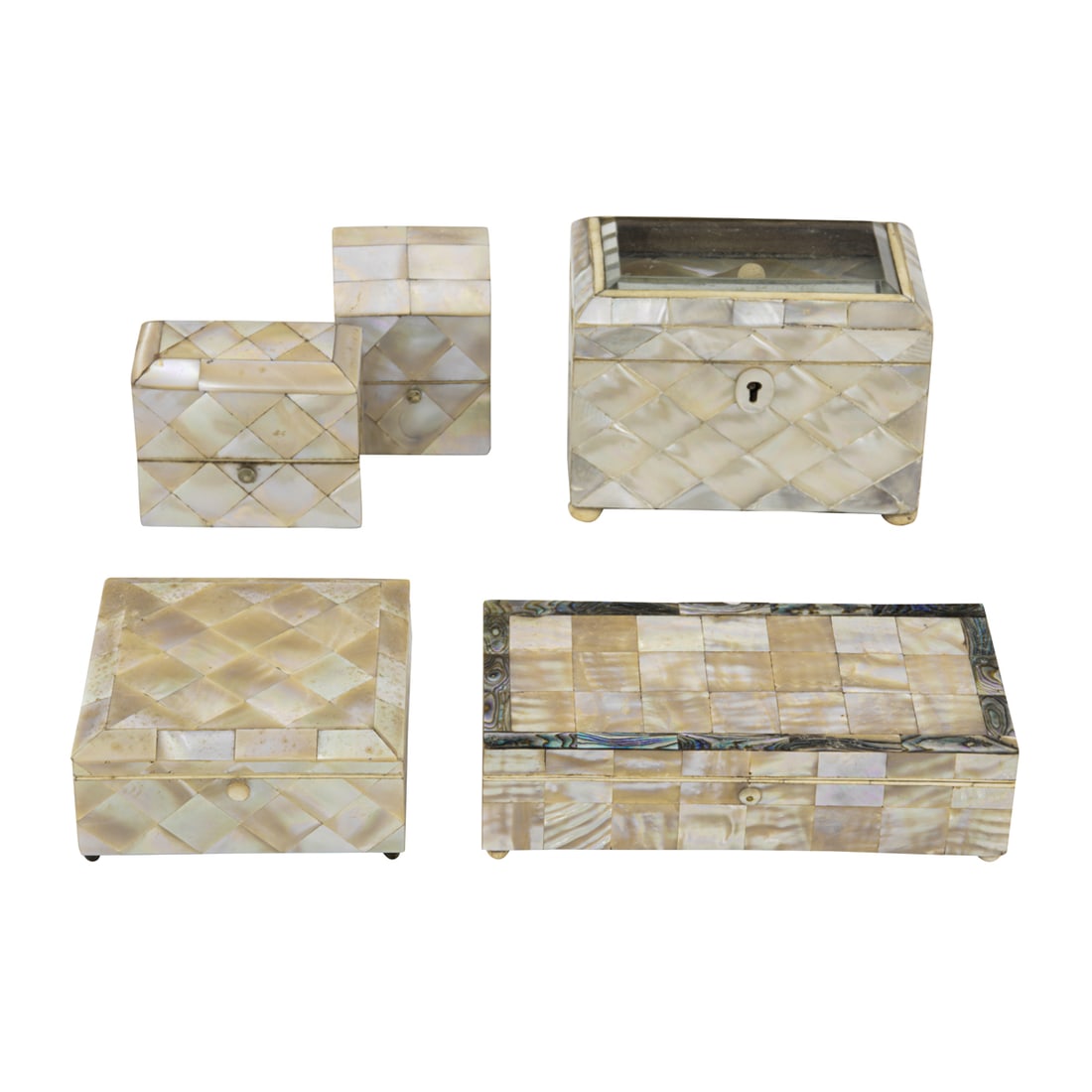 A group of Victorian mother of pearl veneered boxes: A group of Victorian mother of pearl veneered boxes, mid-19th century, including scent bottle case with silver covered bottles; glass topped tea caddy with lidded interior and (3) other boxes, greates