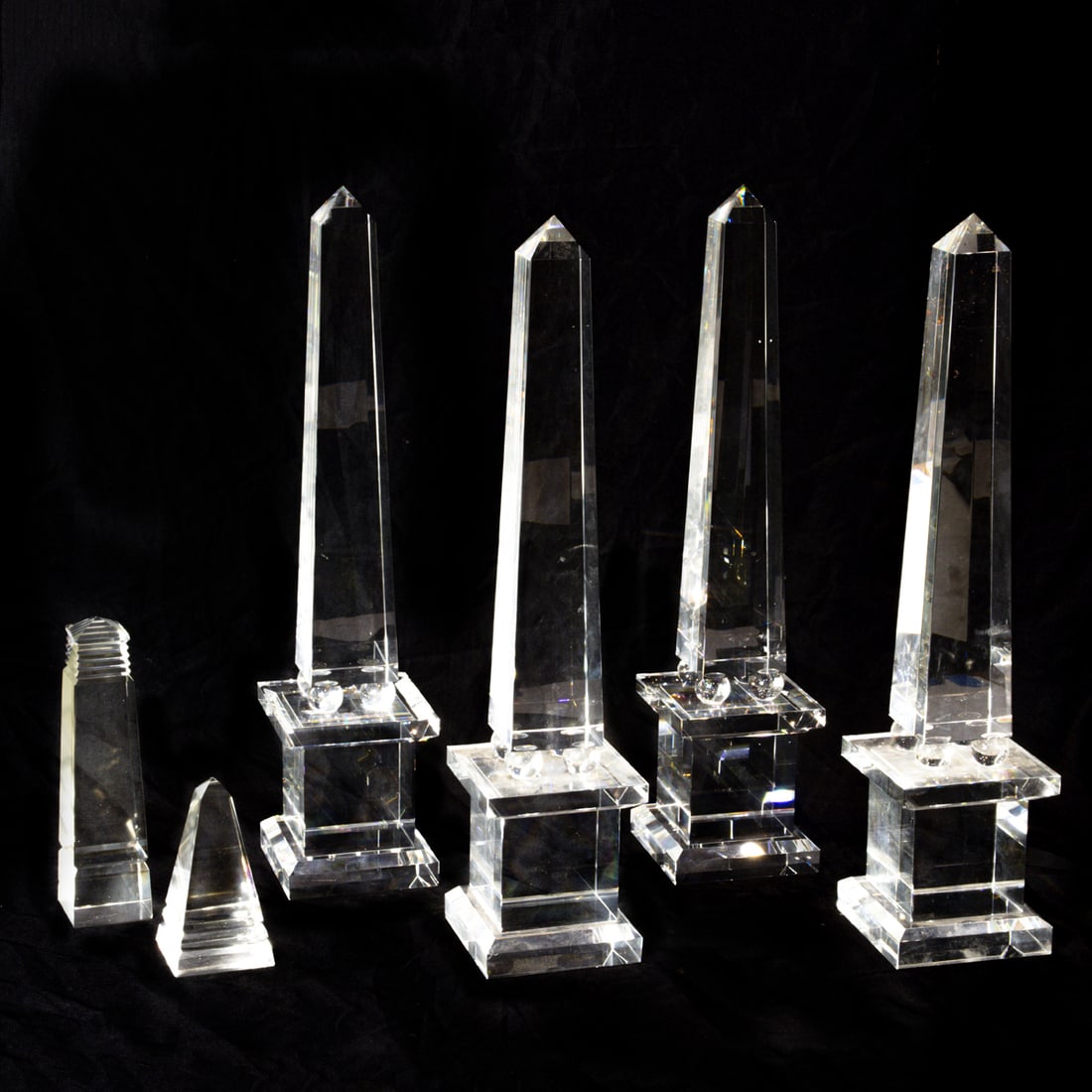 A suite of four glass obelisks on stands: A suite of four glass obelisks on stands, each with WSH factory mark, 19"h, together with two others [6 total]