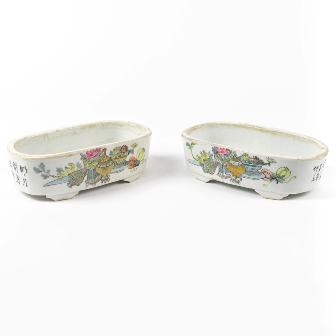 A pair of Chinese famille rose jardinieres: A pair of Chinese famille rose jardinieres. Featuring hundred antiques and calligraphy, 7.75" across.