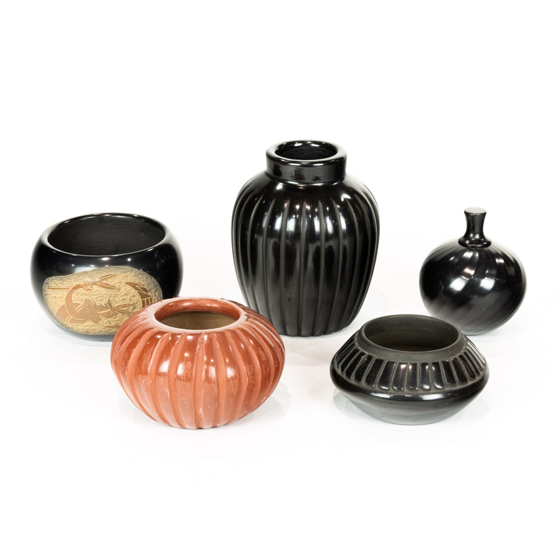 Five Santa Clara mostly blackware pots, including an Alvin Baca blackware vase; an Angela Baca: Five Santa Clara mostly blackware pots, including an Alvin Baca blackware vase; an Angela Baca redware vase; and a Danny Gutierrez black ware scent bottle, the largest 5"h