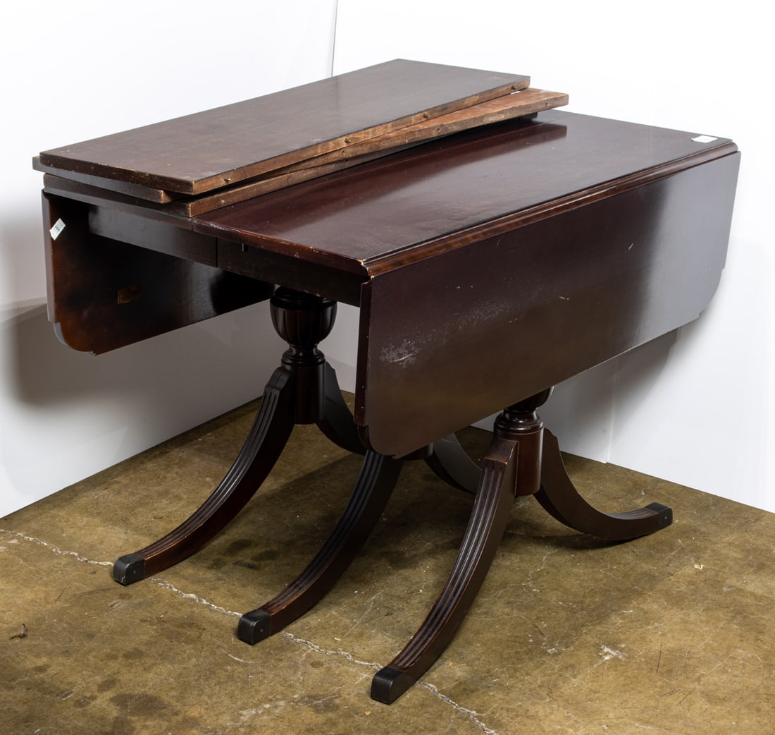 Duncan Phyfe style triple pedestal dining table: Duncan Phyfe style triple pedestal dining table, having three leaves, 30"h x 50.5"l w x 42"d;