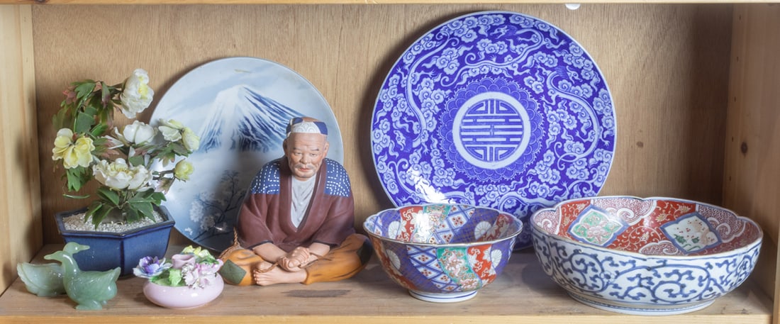 A shelf mostly Japanese decorative objects: A shelf mostly Japanese decorative objects. 12" widest.