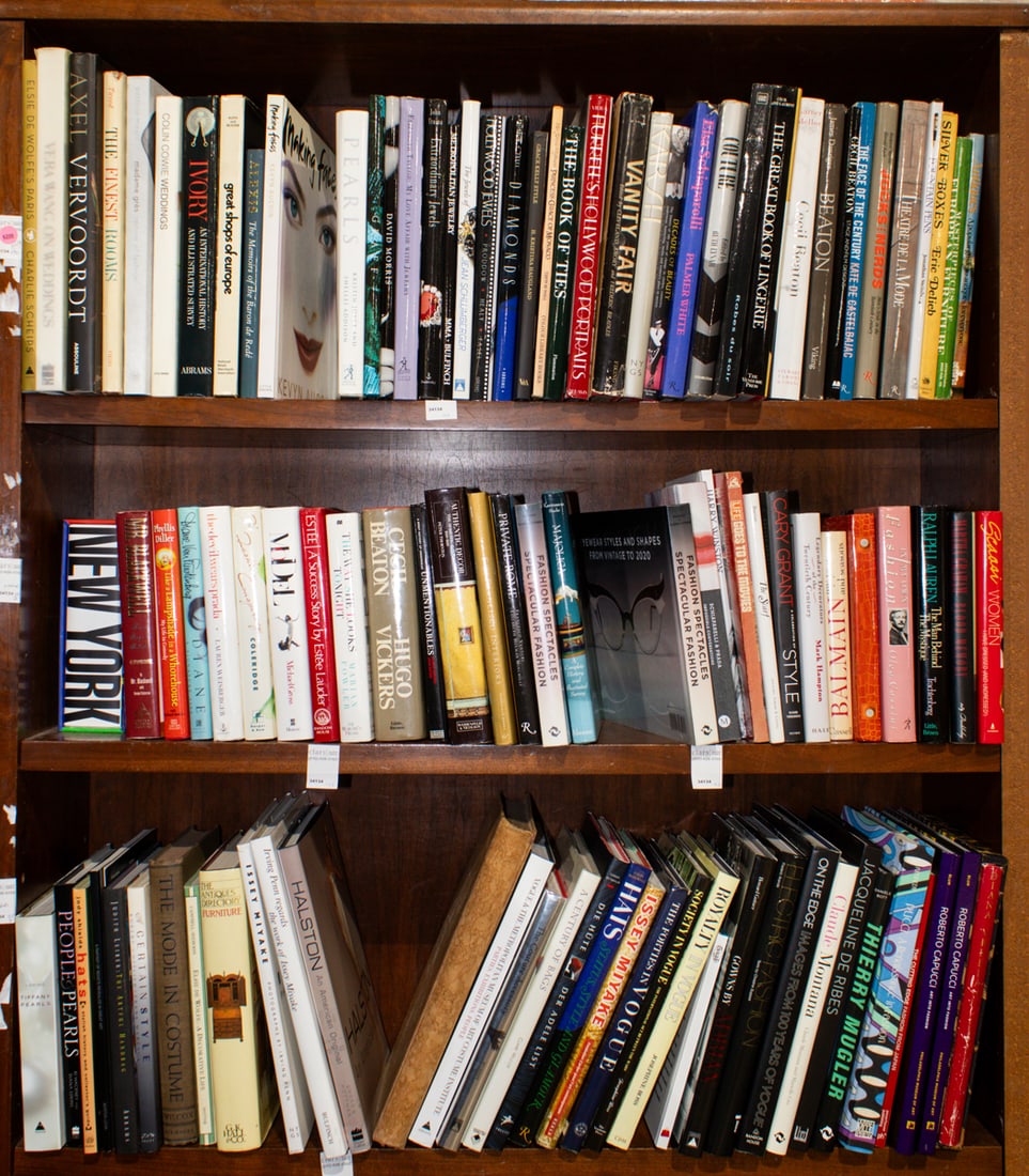 Three shelves of mainly hardback books relating to fashion and interior design: Three shelves of mainly hardback books relating to fashion and interior design, including 'Cecil Beaton'; 'Balmain: My Years and Seasons'; 'Legendary Decorators of the twentieth Century' by Mark Hampt