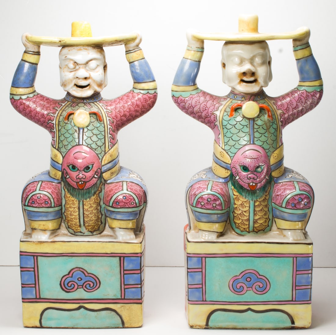 A pair of Chinese famille rose figural candle holders (1 of 2)