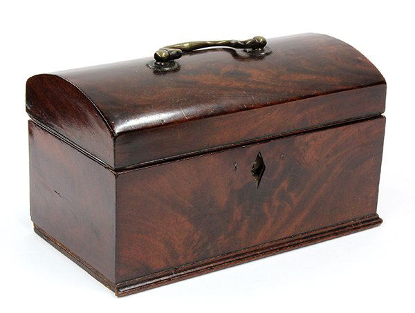 Continental hinged box: Continental hinged box. Executed in mahogany circa 1870, the domed top with a bale pull opening to the paper lined interior and rising on a rectangular base, 5.5"h x 9.5"w x 5"d
