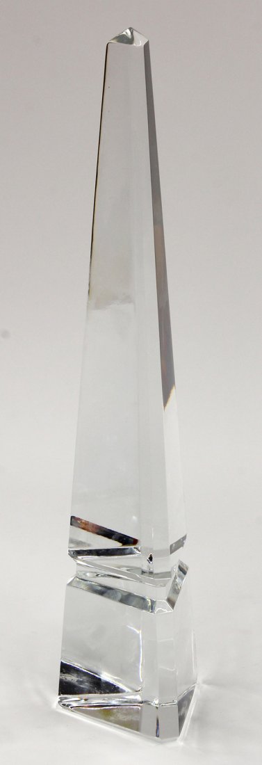 Baccarat crystal obelisk: Baccarat crystal obelisk. Having a faceted body continuing to the contoured waist, acid marked Baccarat France on base, 15"h