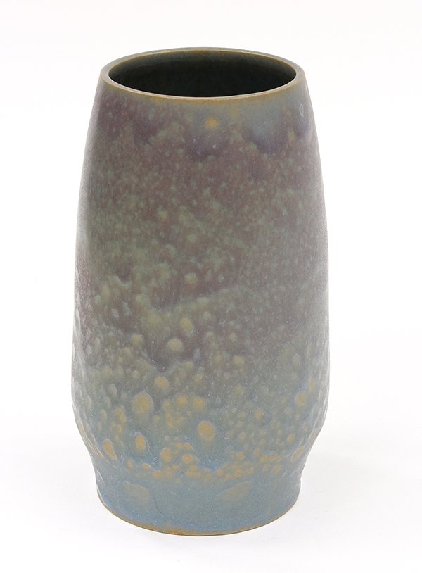 Frederick Rhead (Santa Barbara) vase: Frederick Rhead (Santa Barbara) vase, the mottled blue to violet drip glaze encompassing the cylindrical body having a tapered waist and rising on a circular base, impressed mark, 6.75"h x 4"w