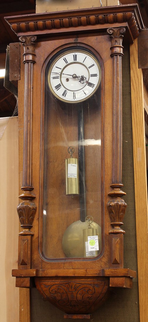 German regulator wall clock: German regulator wall clock, having a single door flanked with fluted pilasters opening to the enamel decorated dial with Roman markers, 39"h x 14.5"w