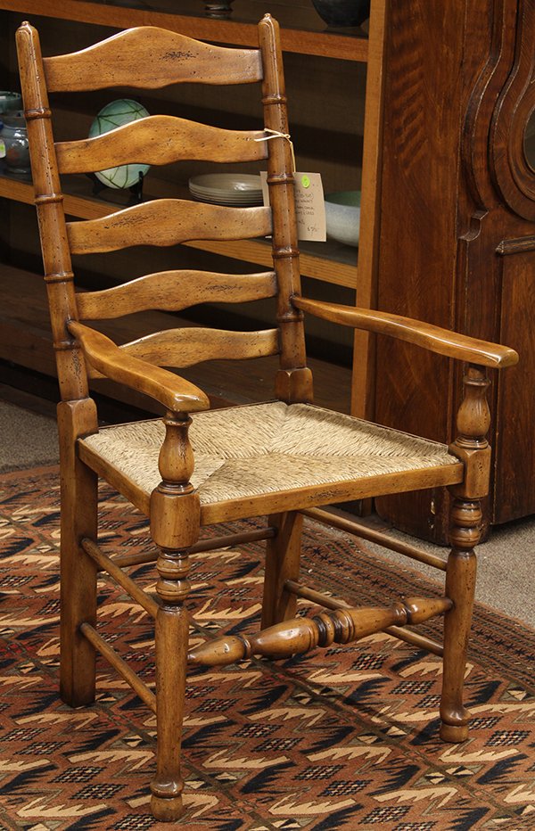French Provincial style ladder back armchair: French Provincial style ladder back armchair, having turned stiles continuing to the rush seat and rising on baluster turned legs, 41"h x 21"w x 17"d Provenance: From the Design Center Showroom of Tay