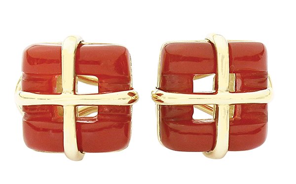 Pair of Tiffany carnelian earrings 18K yellow gol: Pair of Tiffany & Co. carnelian earrings, with omega post backs; mounted in 18K yellow gold (stamped "750", "copyright 2002", "Tiffany & Co."), having two square pierced cabochon cut carnelians. Total