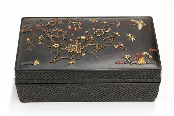 Chinese Hardwood Box with Stone Overlay: Chinese black wood box with stone overlays, the rectangular lid featuring butterflies amid flowering prunus executed in soapstone, mother-of-pearl and wooden overlays, while the sides are carved with 