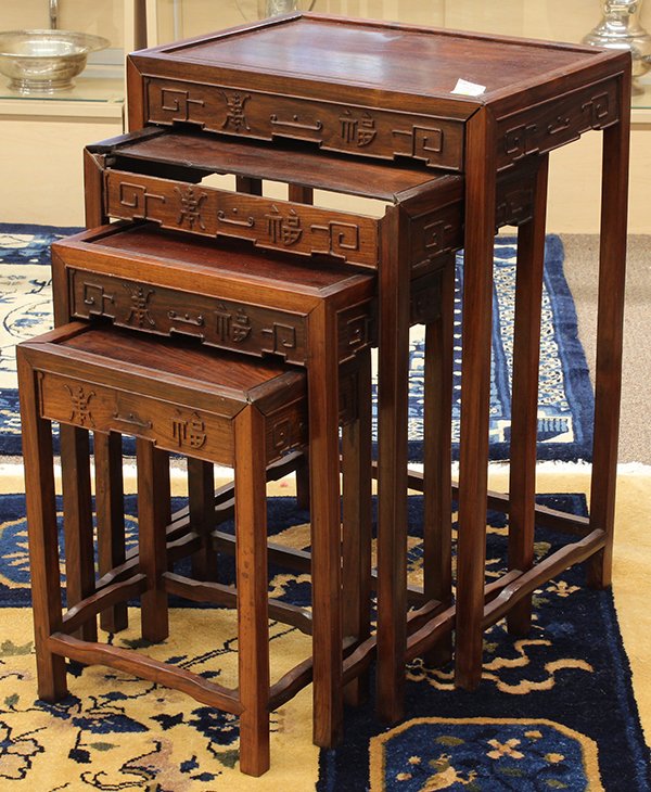Set of Chinese Nesting Tables: (lot of 4) Chinese wooden nesting tables, each set with a rectangular floating panel within a plain edge, the apron relief carved with the characters shou (longevity) and fu (good fortune), all raised