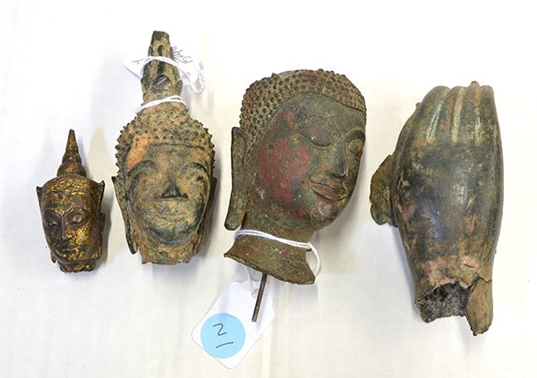 (Lot of 4) Group of Thai bronze Buddhist sculptures: (Lot of 4) Group of Thai bronze Buddhist sculptures, 18th/19th century, consisting of three Buddha heads, the largest with sharply defined facial features (lacking ushnisha), one crowned Buddha head w
