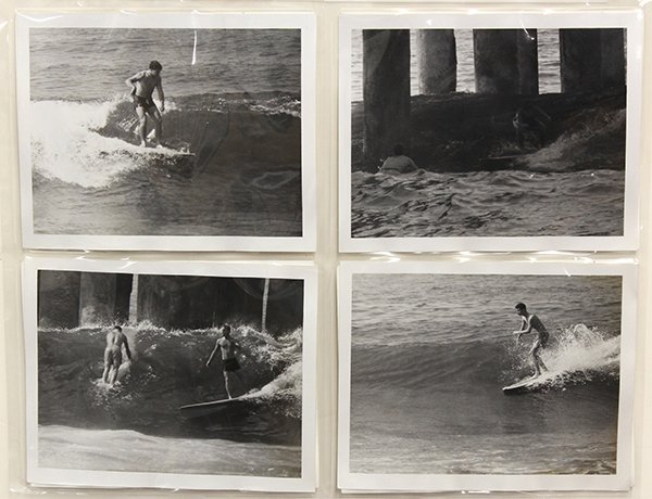 Surfing photographs by LeRoy Grannis: (lot of 17) Unframed photographs, ''Manhattan Beach,'' 1961, by LeRoy Grannis (Californian, 1917-2011), each stamped ''Feb 18, 1961'' verso, print (each): 4''h x 5''w. Provenance: Estate of LeRoy Gran