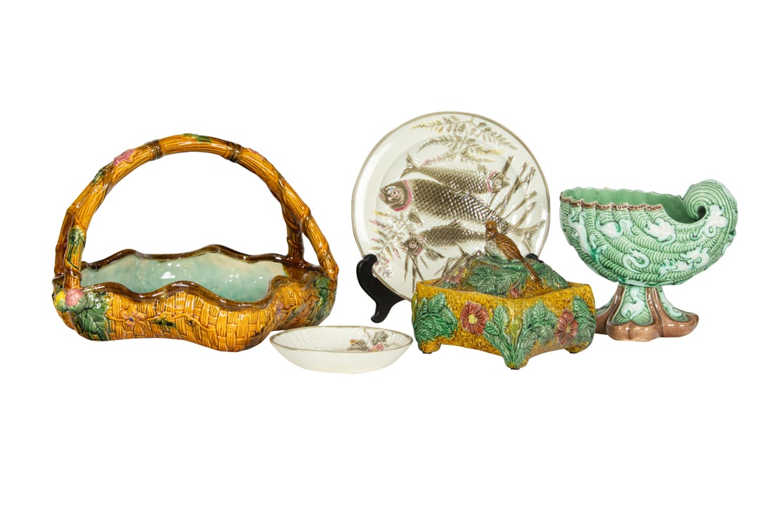 An assembled group of majolica: An assembled group of majolica, comprising nautilus vessel molded with sea creatures, indistinctly marked, 7"h, lobed majolica basket, possibly George Jones, square box with bird finial; Wedgwood trip