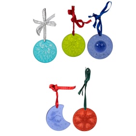 A group of thirteen Lalique colored glass Christmas ornaments in factory boxes