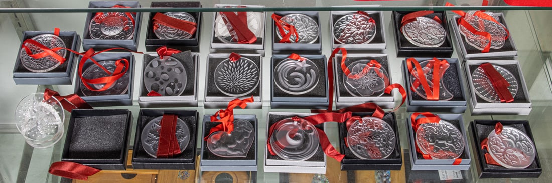 A group of twenty-two Lalique clear glass Christmas ornaments in factory boxes: A group of twenty-two Lalique clear glass Christmas ornaments in factory boxes, between 2.5"dia and 3"h