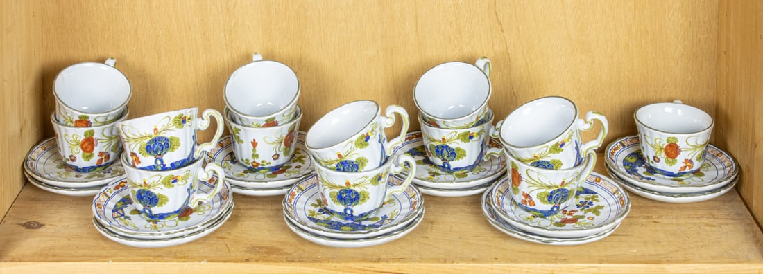 A group of ceramics including majolica and porcelain: A group of ceramics, comprising set of Garofano AMM majolica cups and saucers, each decorated with floral designs, comprising (13) cups and (14) saucers, painted mark, 2.5"h (cup) and a group of gilt 