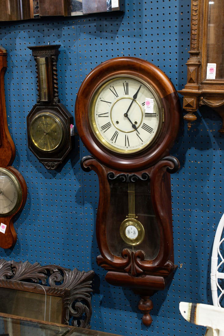 Two regulator wall clocks and a diminutive barometer (1 of 2)