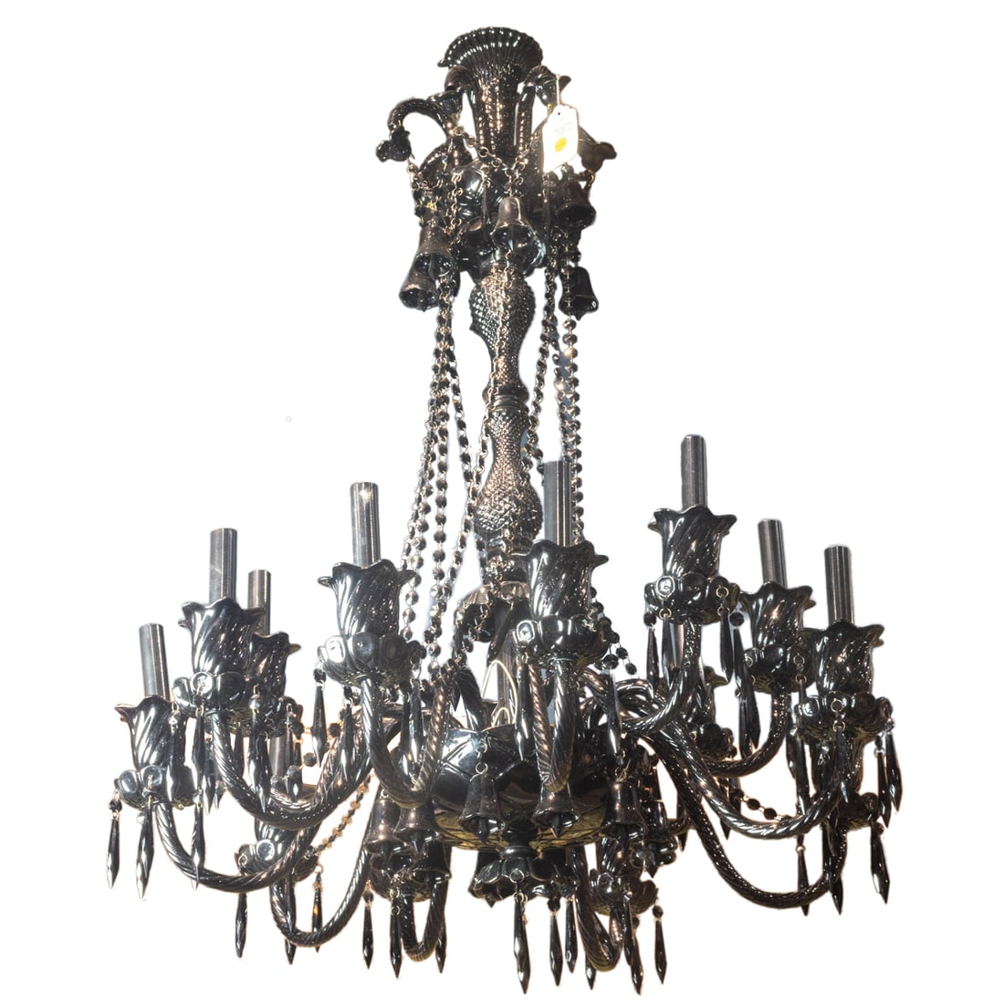 A Baccarat style black glass fourteen light chandelier: A Baccarat style black glass fourteen light chandelier, the baluster support issuing s-scrolled candle arms, hung with faceted drops and beaded swags, 42"h x 33"dia