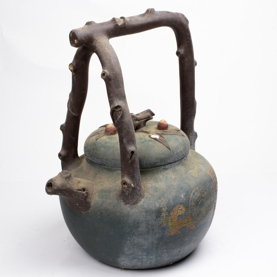 A Chinese Yixing Zisha teapot: A Chinese Yixing Zisha teapot. Featuring an incised poem, bearing one seal at the bottom and one seal inside the cover, 16" high.