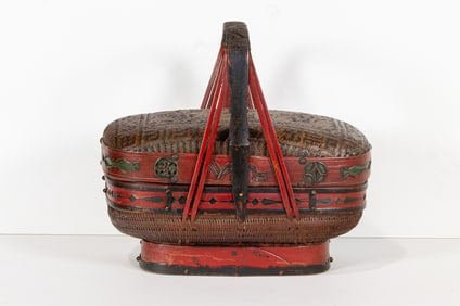 A Chinese woven cane and bamboo basket with handle