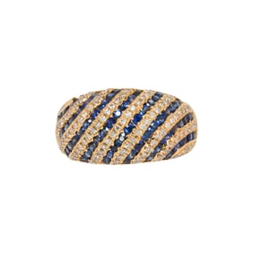 A sapphire, diamond and 18k gold ring