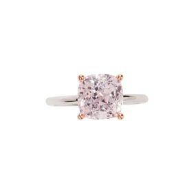 A pink sapphire, diamond and 18k bi-color gold ring