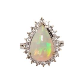 An opal, diamond and 14k white gold ring
