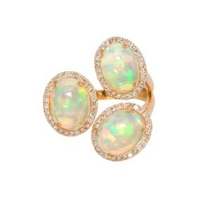 An opal, diamond and 18k gold ring