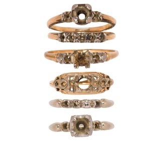 A group of gold semi-mount rings