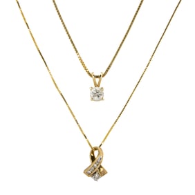 Two diamond and gold pendant necklaces