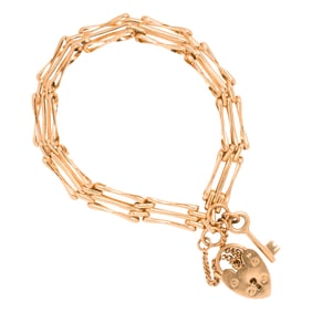 A 14k gold heart lock clasp bracelet, English