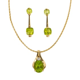 A peridot and 14k gold necklace and pair of earrings