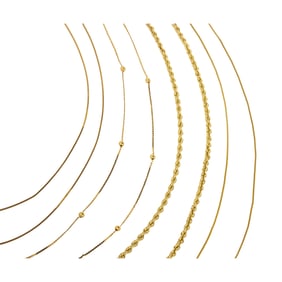 A group of 14k gold chains