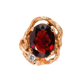 A garnet, diamond and 14k gold ring