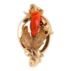 A coral and 14k gold brooch