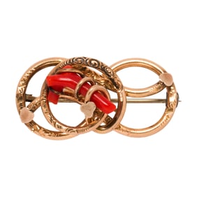 A coral and 10k gold brooch