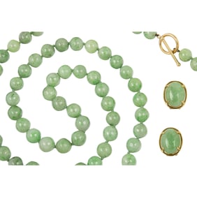 A jade bead necklace and matching earrings