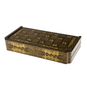 A Chinese export black and gilt lacquered chessboard