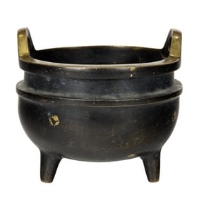 A Chinese parcel-gilt bronze tripod censer