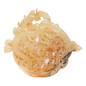 A Chinese mottled celadon jade dragon pendant