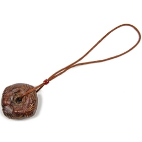 A Chinese hardstone circular pendant