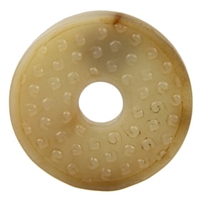 A Chinese small jade bi disc