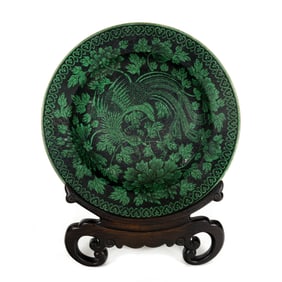 A Chinese green enameled black ground 'phoenix' charger