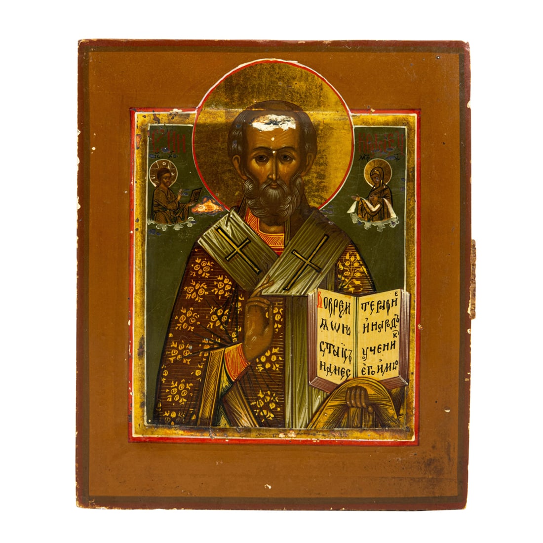 A Russian icon of a Saint: A Russian icon of St. Nikolai, the rectangular form centering the figure of the Saint wearing a Bishop's robe, holding the Gospels in one hand, giving a blessing in the other, 7.5"h x 10.5"w x 2"d