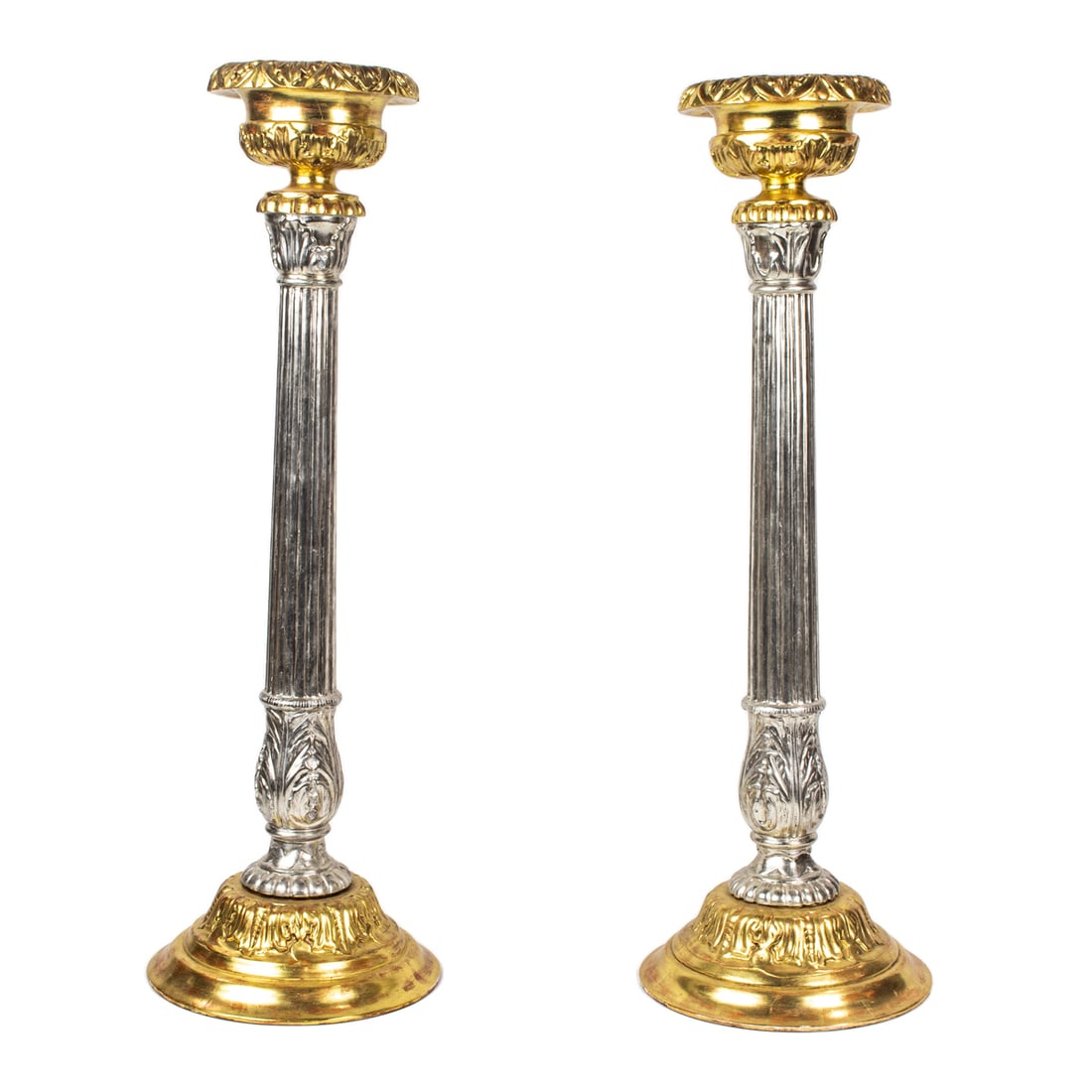 A pair of Maitland Smith Baroque style silvered and giltwood candlesticks: A pair of Maitland Smith Baroque style silvered and giltwood candlesticks, factory label to underside, greatest 26"h